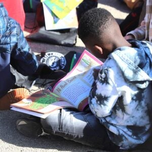 Student reads at farm