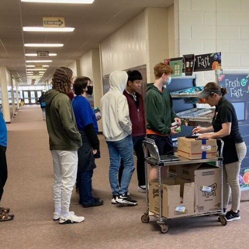 Students line up for breakfast.
