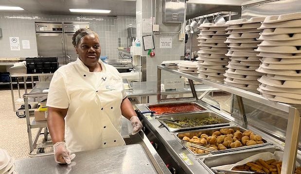 Valrie Baker stands in her school kitchen