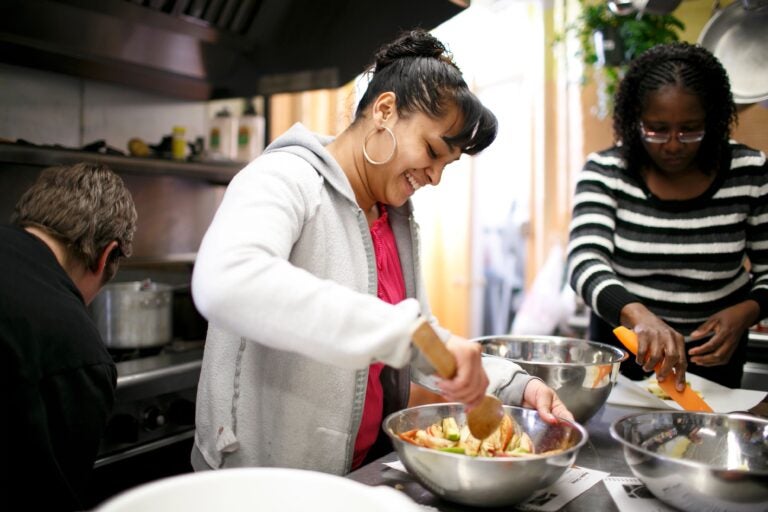 Two women cook together